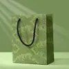 Fábrica en stock Explosivo Lujo Ligero Cinta Verde Regalo de Acompañamiento Bolso de Mano Caja de Dulces Almacenamiento Bolsa de Embalaje de Regalo Portátil