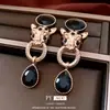 Brincos Pendentes Torcidos com Cabeça de Tigre Inlaid de Diamante Agulha de Prata Brincos de Tarraxa Moda Vintage com Senso de Design Brincos de Nicho