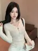 Roupa íntima feminina estilosa de manga comprida, base chique para mulheres, outono inverno, novo estilo, corte justo, mostra a silhueta fina, design oco com nó torcido, top pequeno