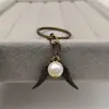 Colgante de Llave de Snitch Dorada Europea y Americana Llavero de Aleación Estilo Bohemio Harry Potter Venta al por Mayor Yiwu
