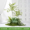 Plantas verdes artificiales al por mayor para paisajismo interior, plantas falsas de alta gama para racimos de musgo decorativos, flores biónicas, decoración suave y decoración de luz
