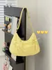 Bolso bandolera de estilo japonés ins, color amarillo crema vibrante, con cordón, fruncido, para estudiantes, versátil para la escuela y el trabajo, bolso tipo dumpling