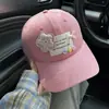 Nueva gorra de béisbol con botón floral de dopamina para mujer, versátil para primavera/verano, linda y dulce, estiliza el rostro, protector solar, moderna