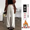 Pantalones de mujer de pierna ancha, holgados, a la moda y casuales, de cintura alta, con finas rayas, bolsillos y un diseño de pierna recta y fluido, hechos de terciopelo de algodón, para otoño e invierno 2026