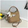 Bolso bandolera retro casual de moda, bolso de hombro simple para mujer, moda transfronteriza 2026 nuevo bolso cubo retro para el día a día