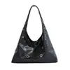 Bolso tote grande de diseño de agujeros metálicos estilo europeo y americano para mujer, nuevo bolso de hombro vintage 2026, bolso suave de cuero para el hombro para el trabajo