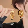 Pendientes de borla redonda con lentejuelas plateadas para mujer, pendientes de moda transfronteriza, sensación de lujo ligero, pendientes de nuevo temperamento, venta al por mayor