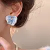 Pendientes de flor tridimensionales súper etéreos de primavera y verano, estilo fresco, pendientes de flor de esmalte azul retro de alta gama de nicho