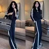Conjunto de Ropa Deportiva para Mujer Otoño 2026: Sudadera con capucha y pantalones de pierna ancha adelgazantes de alta gama, conjunto casual de dos piezas para primavera