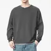 Camiseta de manga larga de color liso para hombre, estilo dos piezas falso, nueva colección primavera y otoño 2025, holgada y versátil, adecuada para usar en capas, sudadera de algodón con cuello redondo