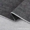 100% Poliéster Espuma Textura Similar al Lino Grano de Cuero Tela para Sofá Fabricante Venta al por Mayor en Stock Tela para Alfombrilla de Piso de Interior de Coche