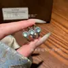 Atacado do fabricante anel de jadeíta azul natural Xiaohongshu com incrustação de prata s925, design de moda fresco e simples