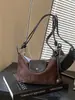 Bolso de axila de estilo francés de nicho transfronterizo para mujer, nuevo bolso de moda tipo albóndiga de gamuza para el trabajo, bolso de hombro y cruzado casual