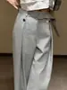Pantalones de traje grises de alta gama, estilo francés sofisticado para el trabajo, principios de otoño de 2026, estilo europeo súper popular, muy elegantes, para figura de pera, pantalones de pierna ancha que cubren las caderas