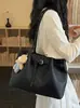 Bolsa de mano para el trabajo, bolsa de gran capacidad para mujer, nuevo modelo de primavera 2026, bolso de hombro de nicho súper popular, bolso de mano moderno para salir