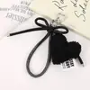 Moda Versátil Lazo Decorativo Colgante de Bolso Creativo Otoño e Invierno Peluche Relleno de Algodón Corazón Bolso Soporte para Teléfono