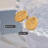 Aretes transfronterizos de acero de titanio de Europa y Estados Unidos, personalidad retro que no se desvanece, temperamento, colgante ovalado, relieve, aretes de rosa, accesorios