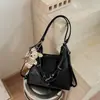 Bolsa de hombro tipo tote de gran capacidad Shuai Mi Jia 2026 nueva casual de nicho mochila simple y elegante