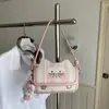 Bolsa de ombro super popular e fofa de gatinho para mulheres, nova bolsa de ombro e transversal casual 2026, pequena bolsa de mão para sair e trabalhar