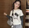 Camiseta de Manga Larga con Lunares Estilo Coreano Falsa de Dos Piezas Cosida para Niñas 2026 Nueva Moda Primavera Dibujos Animados Top para Niñas Tendencia
