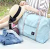 Nueva bolsa de almacenamiento de rendimiento de gran capacidad bolsa de almacenamiento para el hombro bolsa plegable portátil bolsa para avión bolsa de regalo al por mayor en stock