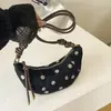 Bolsa de ombro retrô de nicho Shuai Mi Jia para mulheres, novo modelo outono 2026, bolsa de ombro transversal estilosa e texturizada, bolsa de chifre