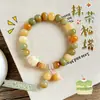 Nuevo brazalete de raíz de bodhi con forma de gato quemado al carbón estilo chino, lindo y de nicho para que jueguen los estudiantes, brazalete decorativo de pata de gato de bodhi para mujeres