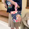 Venta al por mayor del fabricante Bolso de mano artístico de moda Bolso de lona Bolso tipo cubo de gran capacidad para mujer 2026 Nuevo Bolso para almuerzo de trabajo