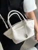 Bolso de mano único y elegante para mujer 2026 nueva moda patrón de lichi bolsa tipo cesta versátil para hombro y cruzado