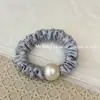Corda de Cabelo de Cetim Pérola Cor Pura Estilo Coreano 2025 Novo Estilo Corda de Cabelo Elástico Alto Faixa de Cabelo Estojo de Couro Elegante