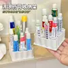 Estante de almacenamiento de ungüentos con forma de ola, organizador de ungüentos de tubo blando para escritorio, estante de exhibición de muestras de cosméticos, venta al por mayor desde el fabricante
