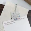 Estilo Ins Lindo y Sanador Gatito Pintado a Mano Texto de Bendición Colgante Llavero Acrílico Accesorio para Mochila de Estudiante