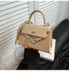 Bolsa Kelly Minimalista de Design de Nicho 2026 Primavera/Verão Nova Versátil para o Dia a Dia Bolsa de Ombro Transversal Fashion