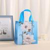 Bolsa de regalo portátil no tejida transfronteriza Fiesta de temporada bolsa de regalo de dulces bolso de mano no tejido al por mayor