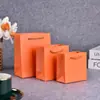 Bolsa de mano para cosméticos de alta gama bolsa para tienda de ropa color vino tinto champán bolsa de regalo bolsa de papel para joyería venta al por mayor