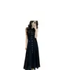 Ropa de mujer de comercio exterior, elegante estilo francés, femenina, suave, sin mangas, tejida, vestido largo, nuevo modelo de verano, de un solo pecho, negro con diseño calado