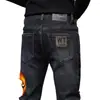 Jeans masculinos slim-fit pretos e cinzas de alta qualidade para o Outono/Inverno 2026, calças compridas casuais trendy e elásticas com forro de fleece