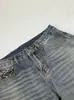 Marca trendy americana retro lavado desgastado estampado de leopardo diseño de bolsillo sentido de la personalidad jeans de pierna ancha corte limpio