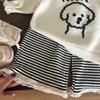 Ropa Infantil Estilo Coreano 2026 Nuevo Otoño Niñas Dibujos Animados Perro Cachorro Suéter de Punto Pantalones Rayados con Flecos Conjunto de Dos Piezas Manga Corta