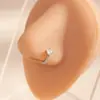Piercing de Nariz Rombo Geométrico Estilo Europeu e Americano com Strass Cruzado Nova Moda Quadrado de Metal Tendência Versátil Piercing de Nariz para Mulheres