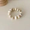 Pulsera elástica de cuentas planas estilo vintage europeo y americano para mujer, pulsera de resina superventas transfronteriza, joyas y accesorios para la mano