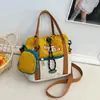 Bolso bandolera de lona nuevo estilo coreano, con un diseño fresco y moderno, perfecto para estudiantes, y un bolso de hombro lindo y versátil que se puede combinar con varios atuendos