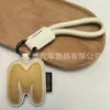 Venta al por mayor transfronteriza de llaveros japoneses y coreanos con letras en inglés, dijes para bolso de cuero dopamina, pequeños accesorios y regalos