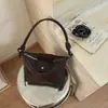 A bolsa de bolinho trançada popular deste ano para mulheres 2026 nova bolsa de ombro simples estilosa bolsa transversal de nicho coreana