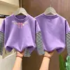 Camiseta básica versátil de estilo coreano, holgada y casual, para primavera y otoño, camiseta de algodón 100% con estampado de dibujos animados para niños, diseño de imitación de dos piezas