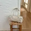 Bolso de mujer de gran capacidad 2026 nuevo bolso de hombro casual de nicho vintage con un toque de alta gama para el trabajo y los desplazamientos, bolso tipo almohada