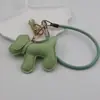 Funda para teléfono con borla de cachorro linda creativa, correa para llavero de coche, accesorio para bolso, universal para teléfonos móviles