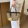 Exquisita y Moderna Bolso de Paja Tejida de Nicho para Mujer 2026 Nueva Moda Versátil Bolso Cruzado Bolso Tote Pequeño Tejido Bolso Cubo