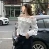 Camisa Branca Elegante com Babados Franceses Design de Alto Padrão Estilo Novo Top Solto Manga Longa Ombro a Ombro Primavera 2025