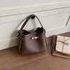 Bolso Cubo Nuevo con Patrón de Lichi 2026 para Mujer Bolso de Mano de Nicho de Gama Alta Versátil para Viajes Diarios Bolso Tote Pequeño Cruzado